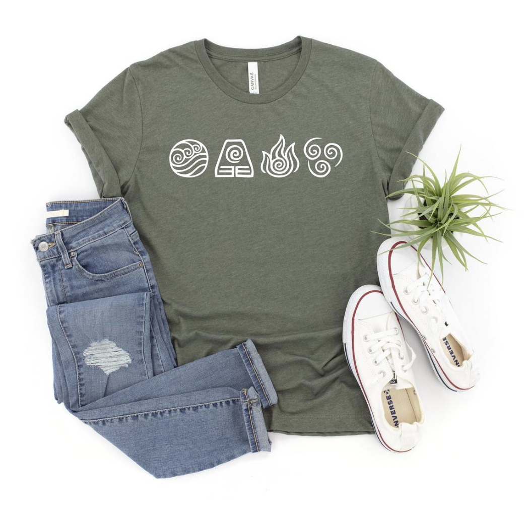 avatar t shirt displayed with pants, shoes and plants 