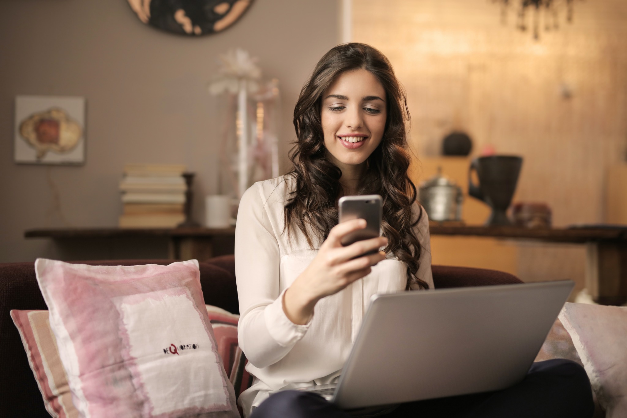 woman smiling at iPhone