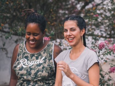 two women smiling and laughing