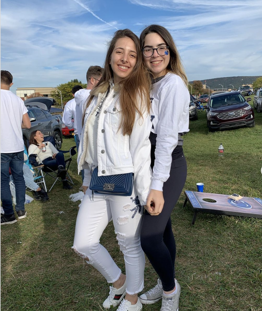 two Penn state students posing