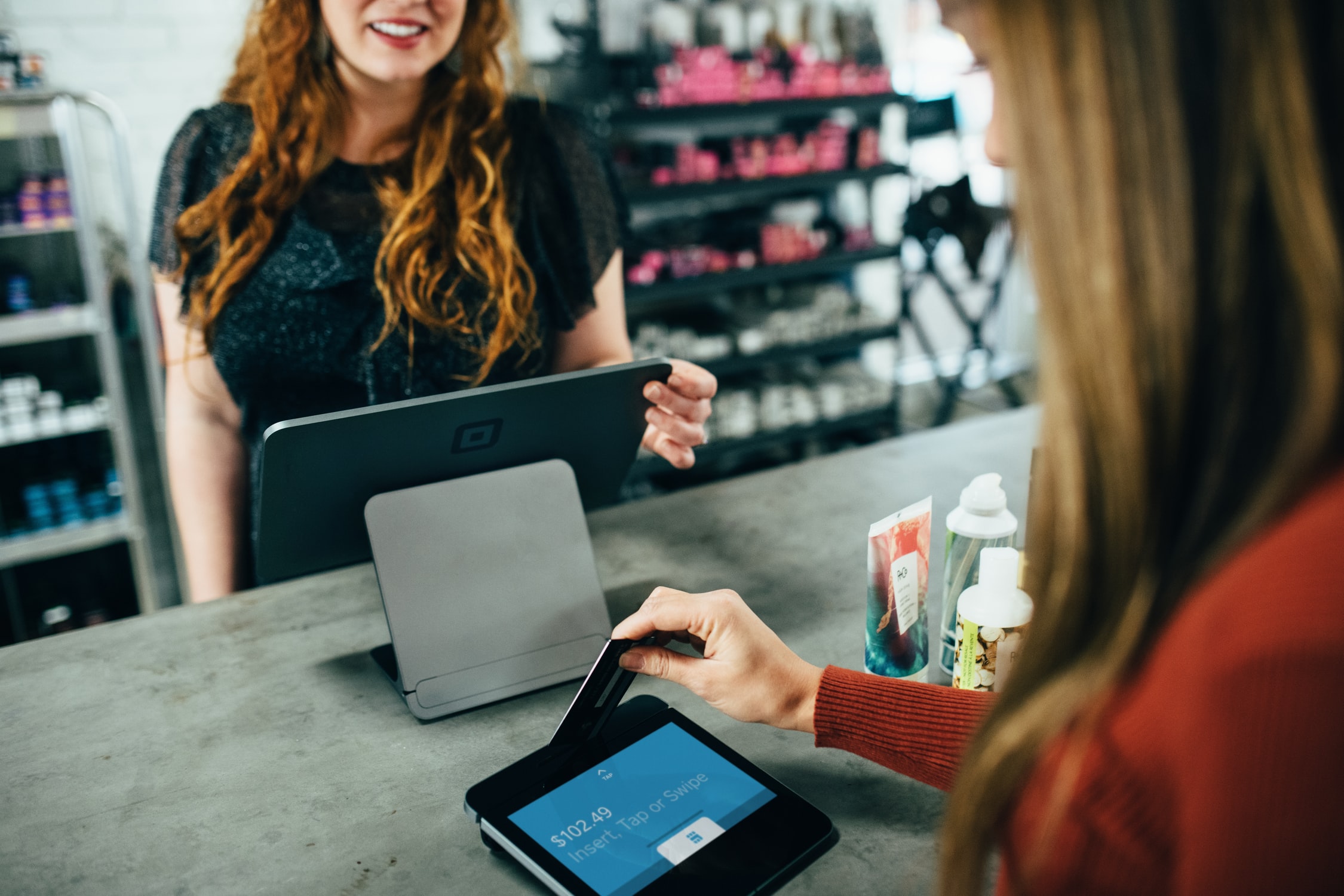 girl paying with credit card