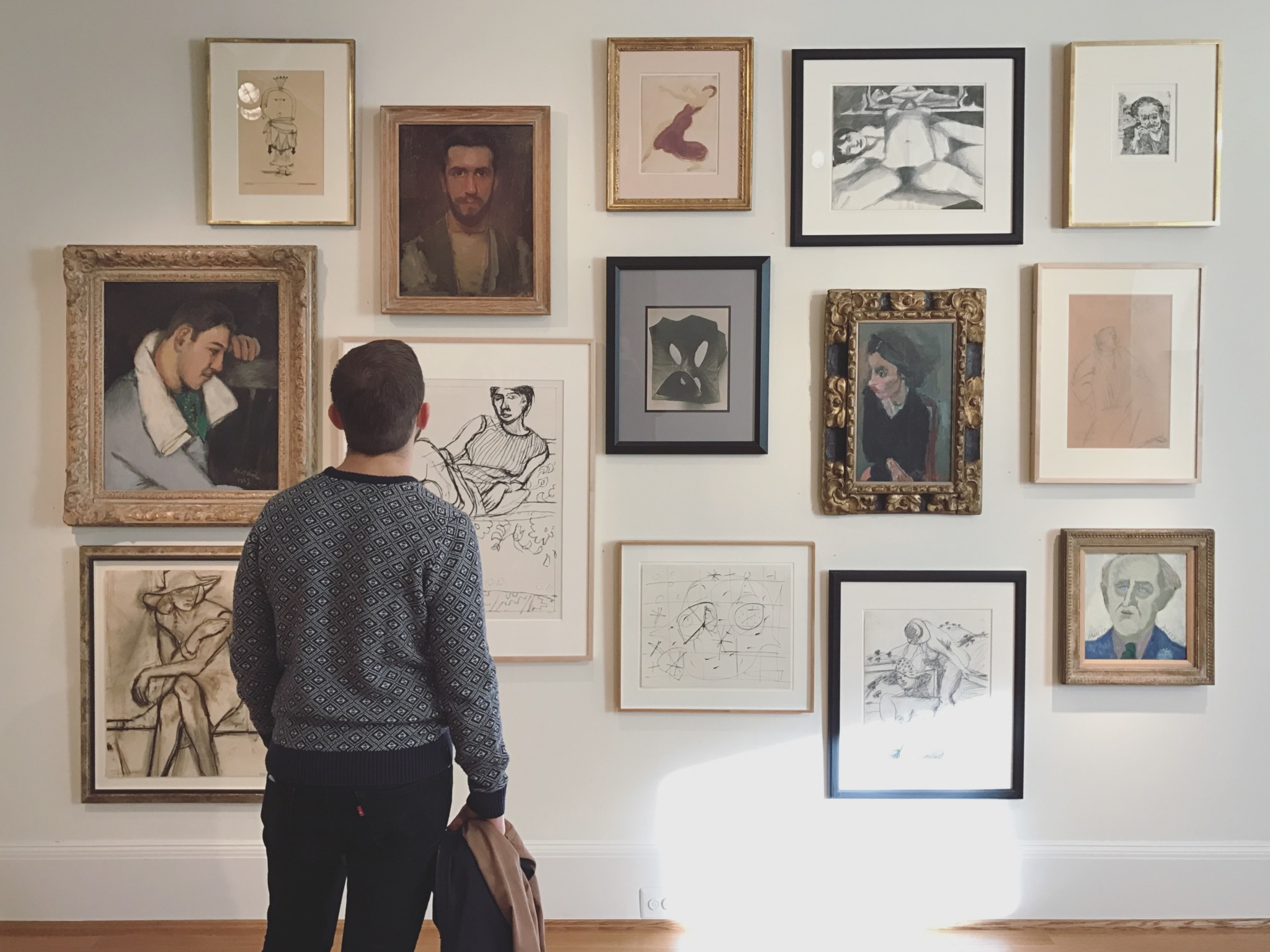 Man Looks at Phillips Collection Paintings