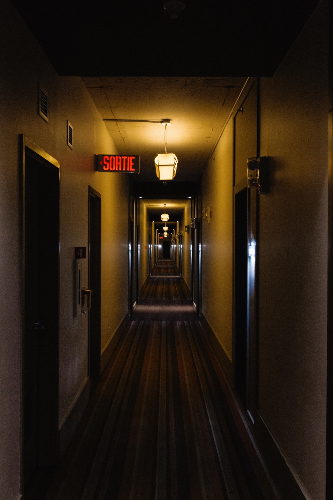 A gray and brown wooden hallway.