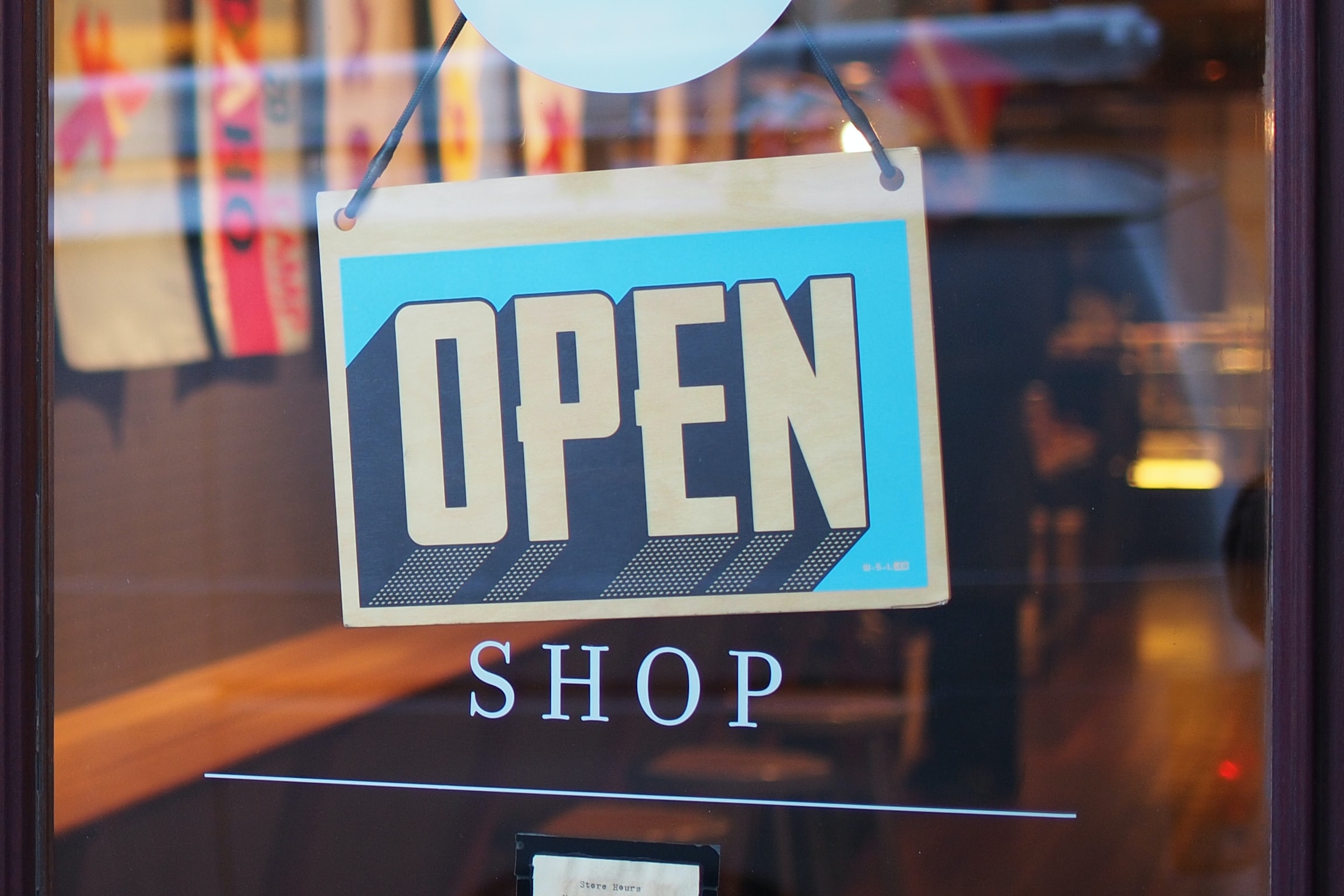 Gray and blue "open" sign.