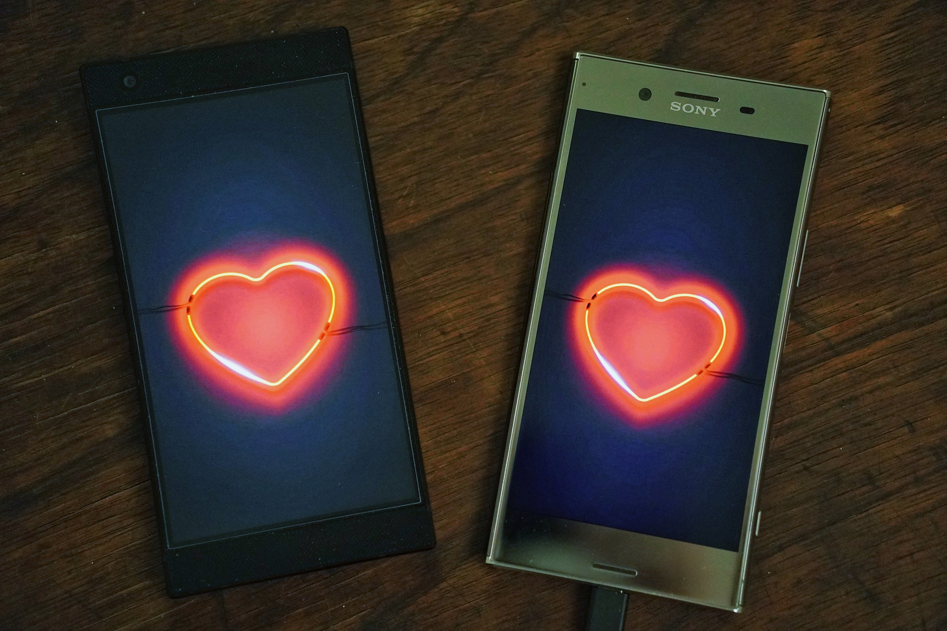 two phones with hearts