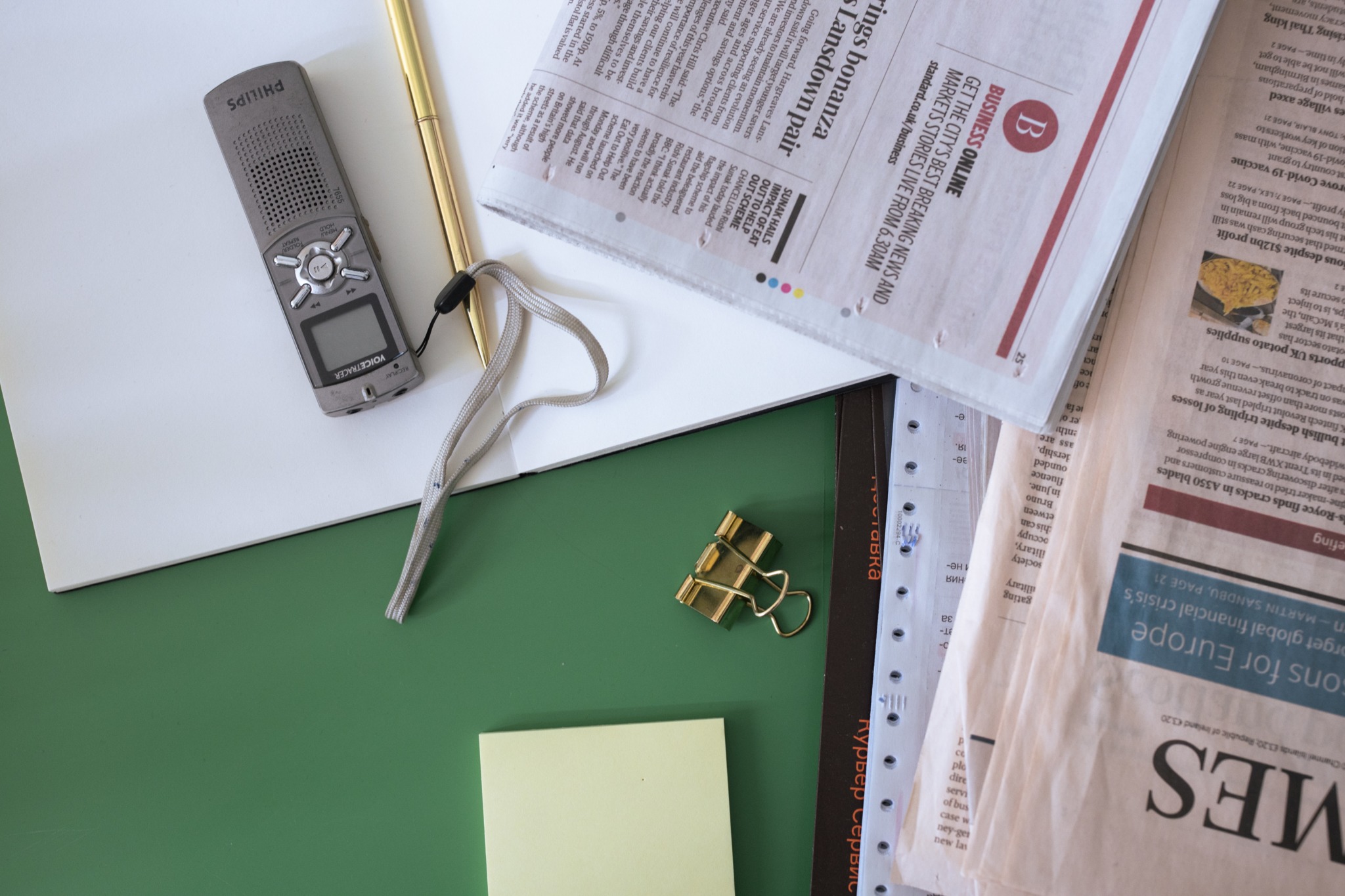 Silver Key Beside Green Sticky Note