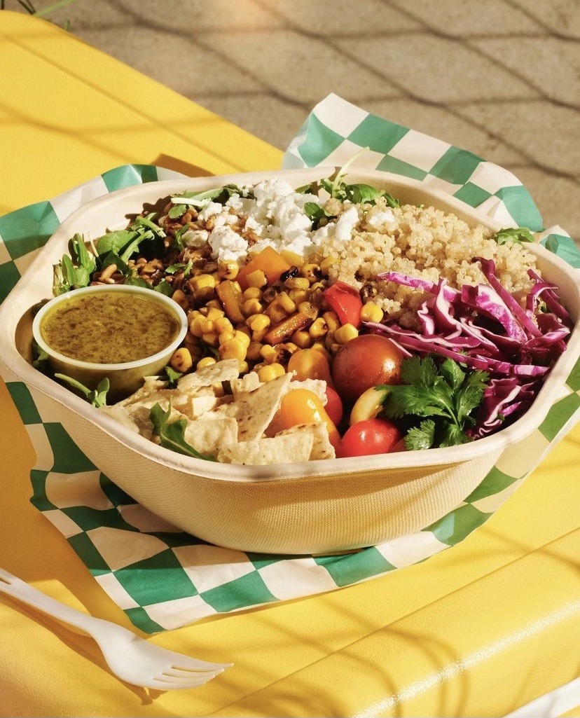 Sweet Green's elote bowl, with ingredients including roasted corn and peppers, heirloom tomatoes, goat cheese, spicy sunflower seeds and tortilla chips