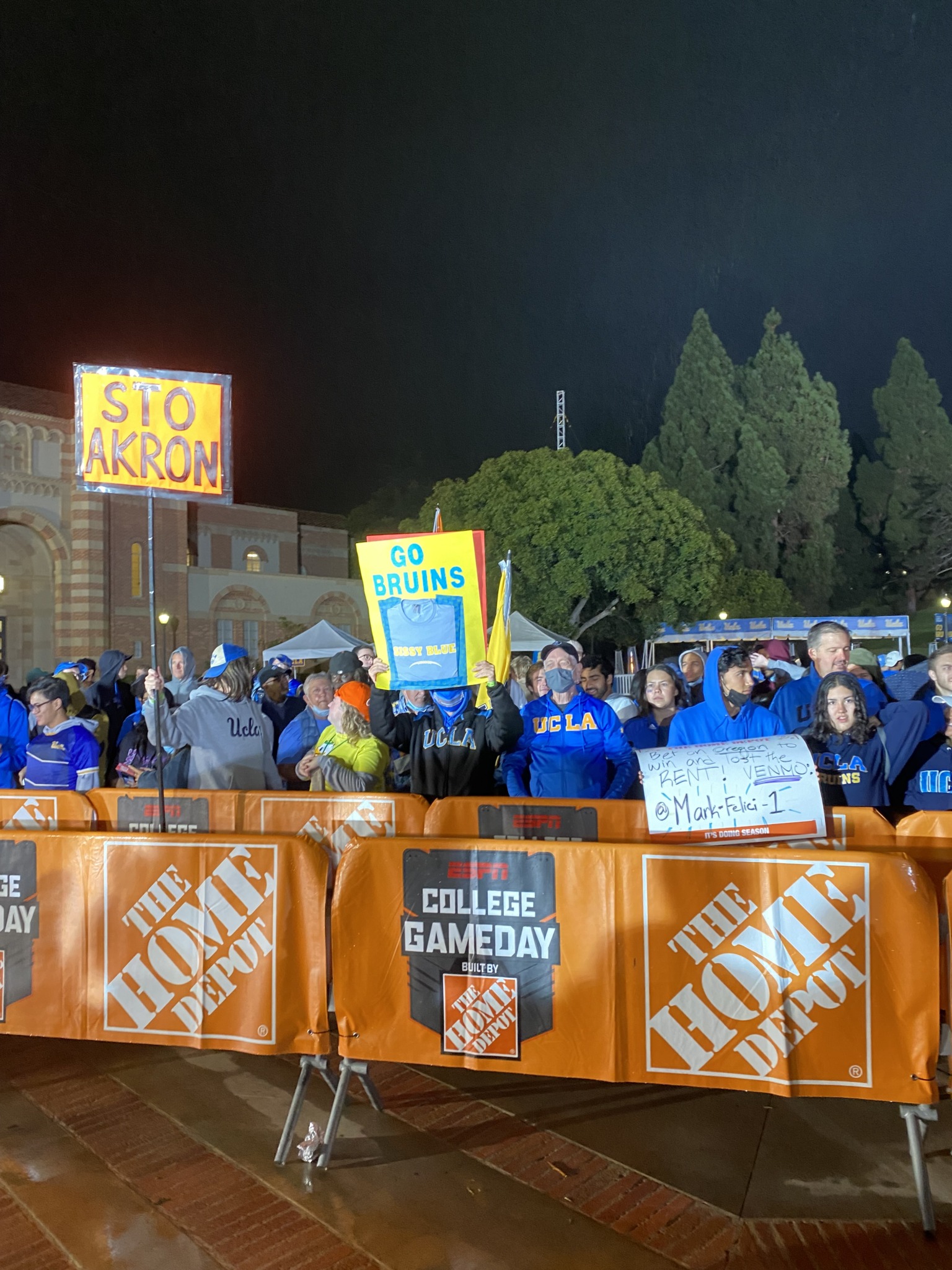 UCLA fans standing in the dark waiting for GameDay to start. 