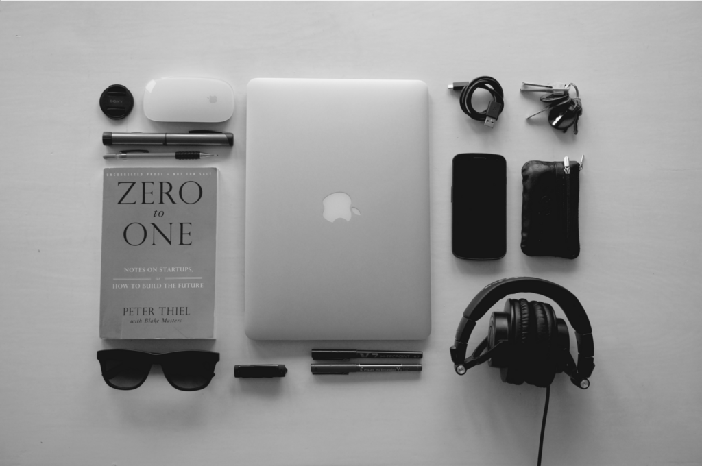 Business items laid out on a blank background in an aesthetically pleasing way