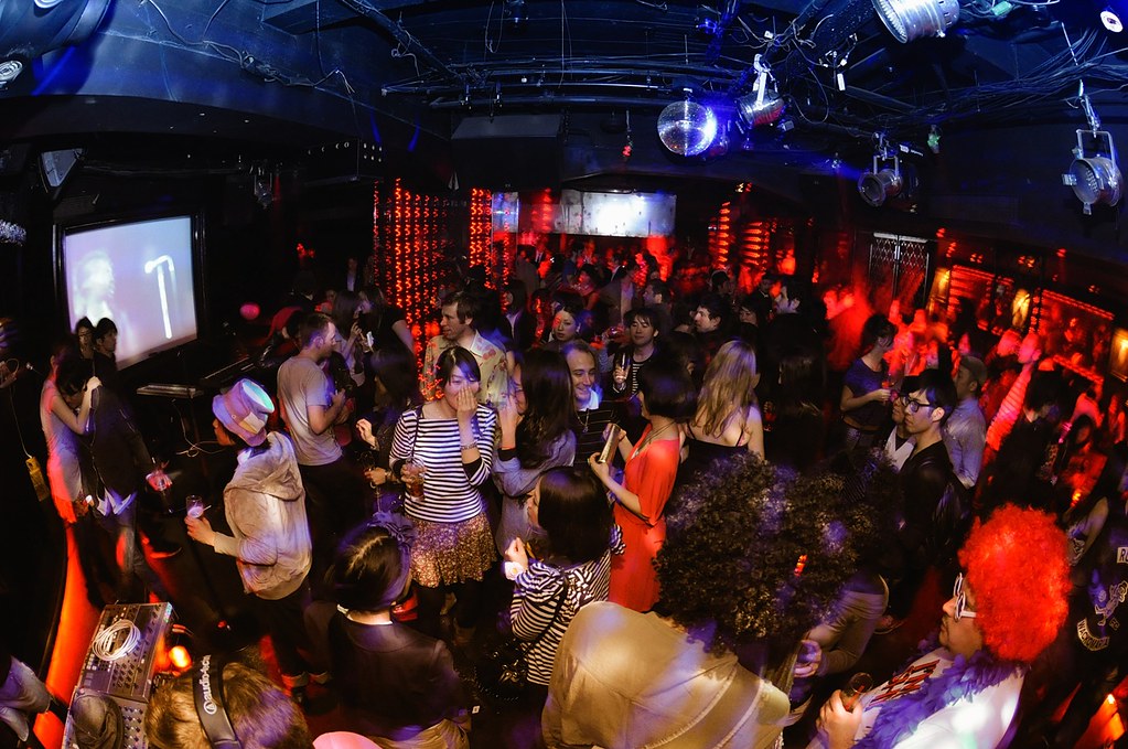 Photo of the interior of a nightclub filled with patrons