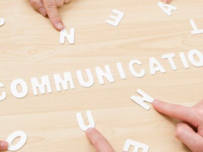 The word communication written on a wooden board with white numbers