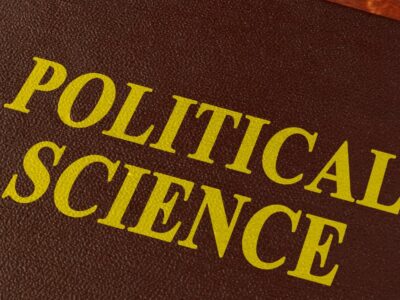 The words political science on a red book