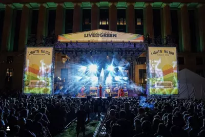 a performer on stage at the Live on the Green music festival